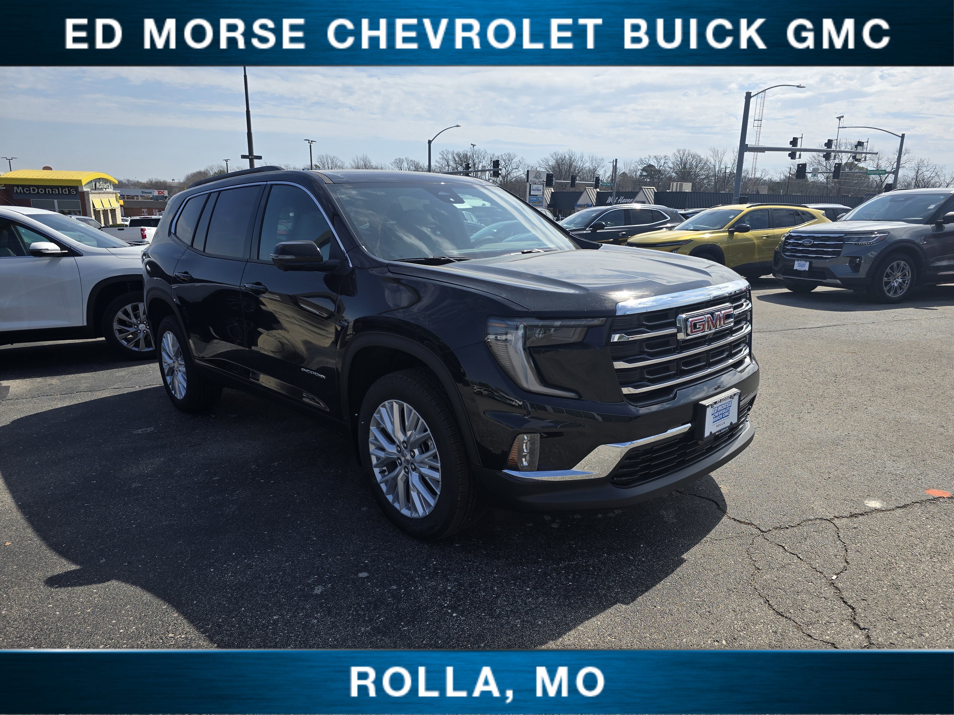 2026 GMC Acadia Elevation in Ebony Twilight Metallic — front three-quarter view