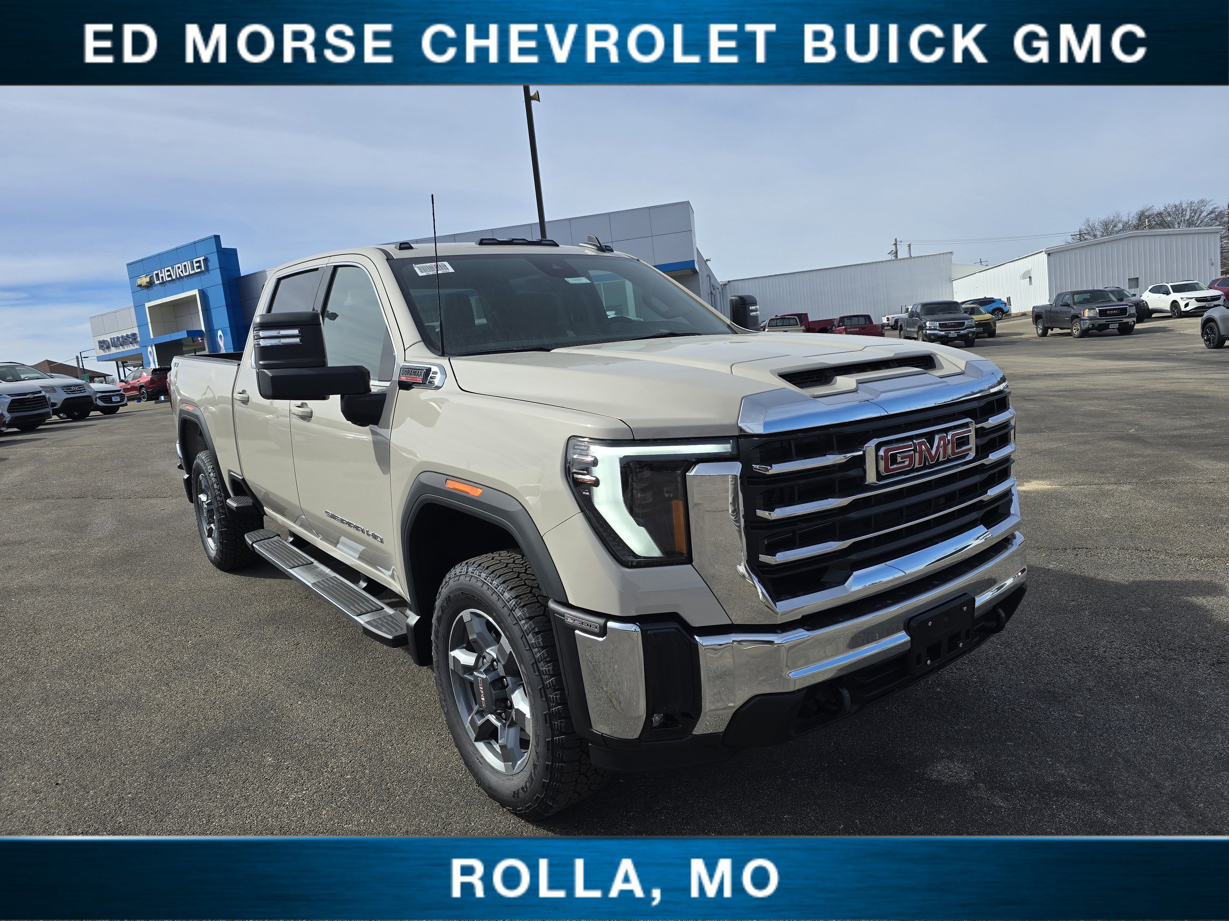 2026 GMC Sierra 2500 HD SLE in Coastal Dune — front three-quarter view