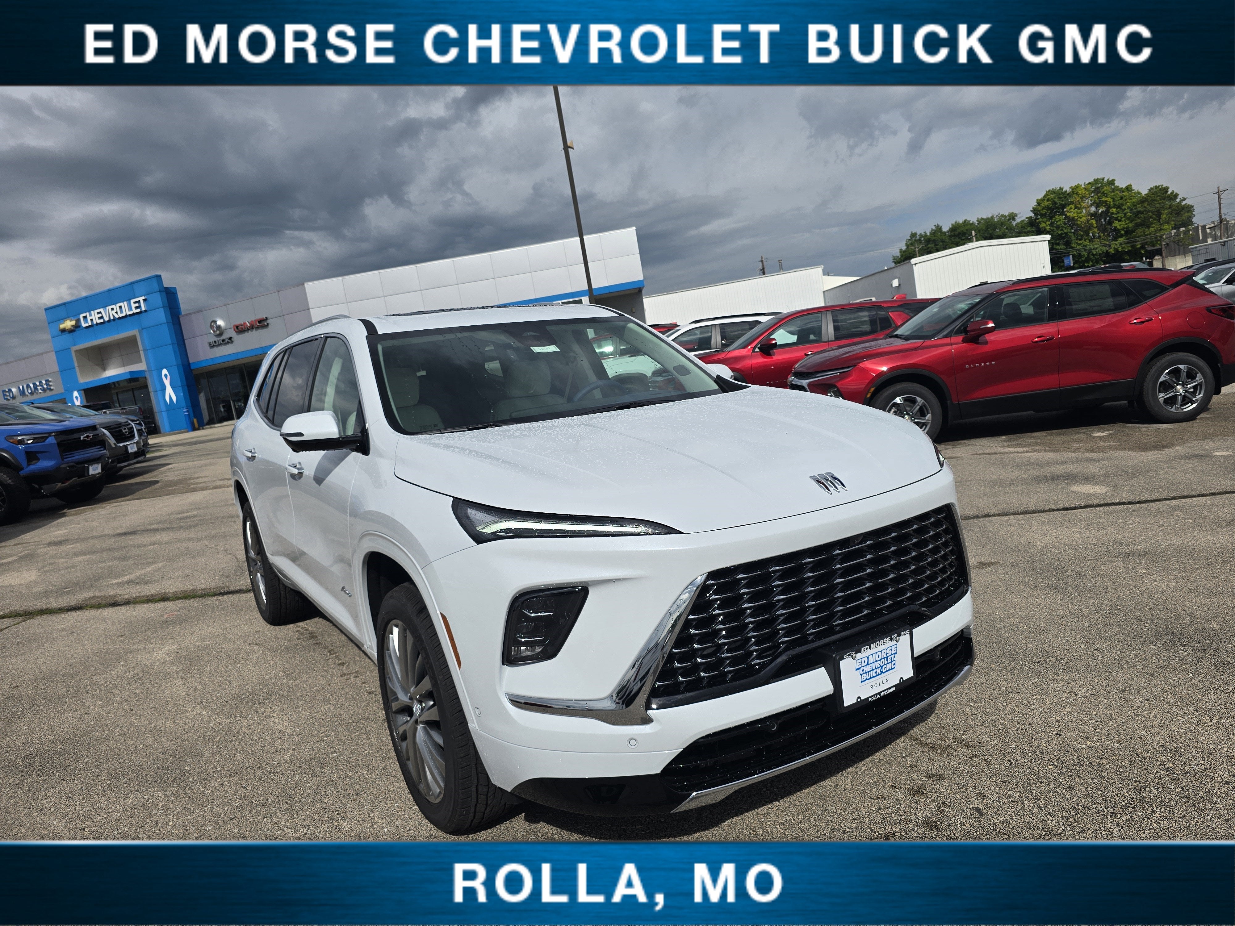 2026 Buick Enclave Avenir in Iridescent White Tricoat — front three-quarter view