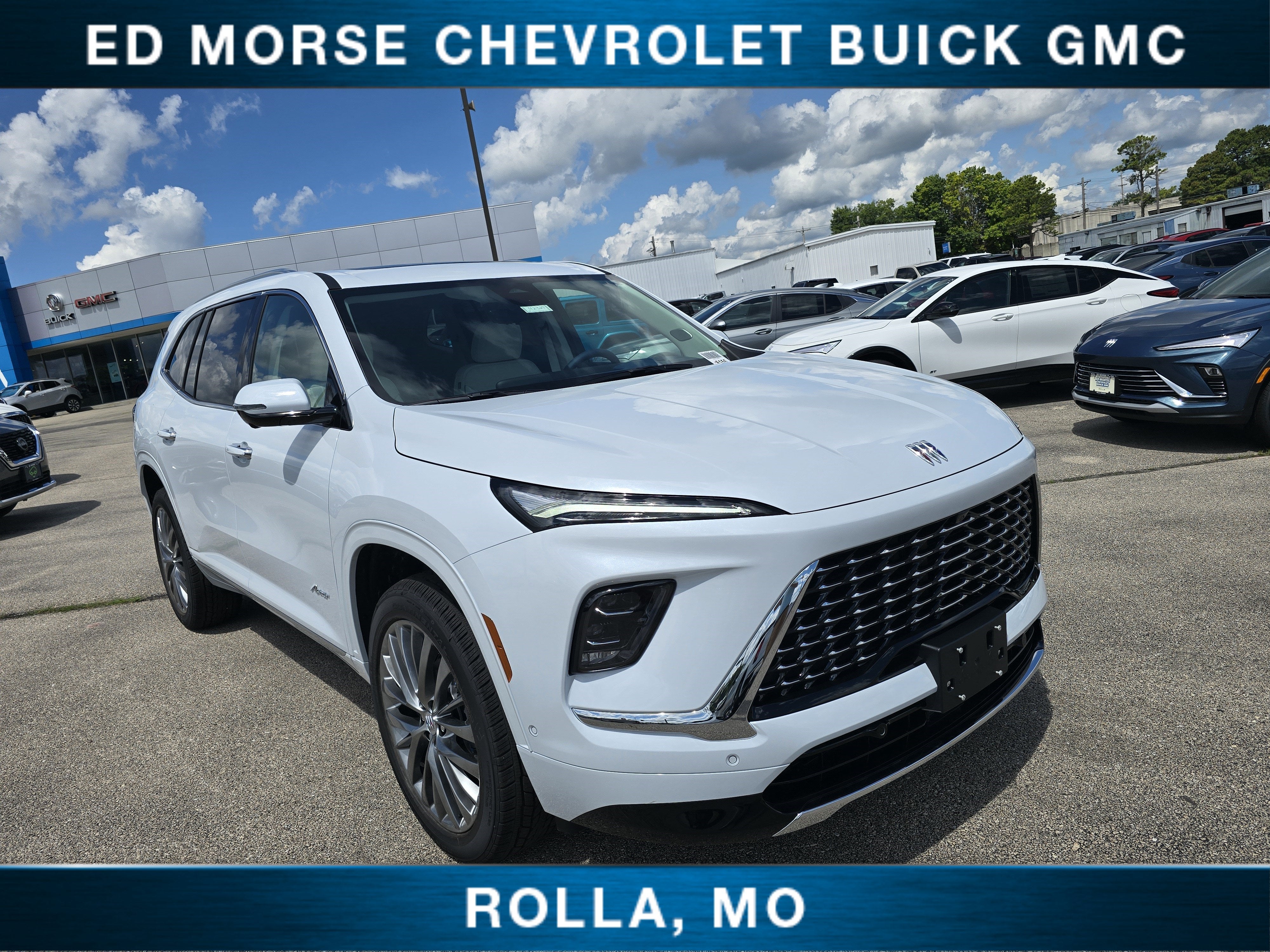 2026 Buick Enclave Avenir in Iridescent White Tricoat — front three-quarter view