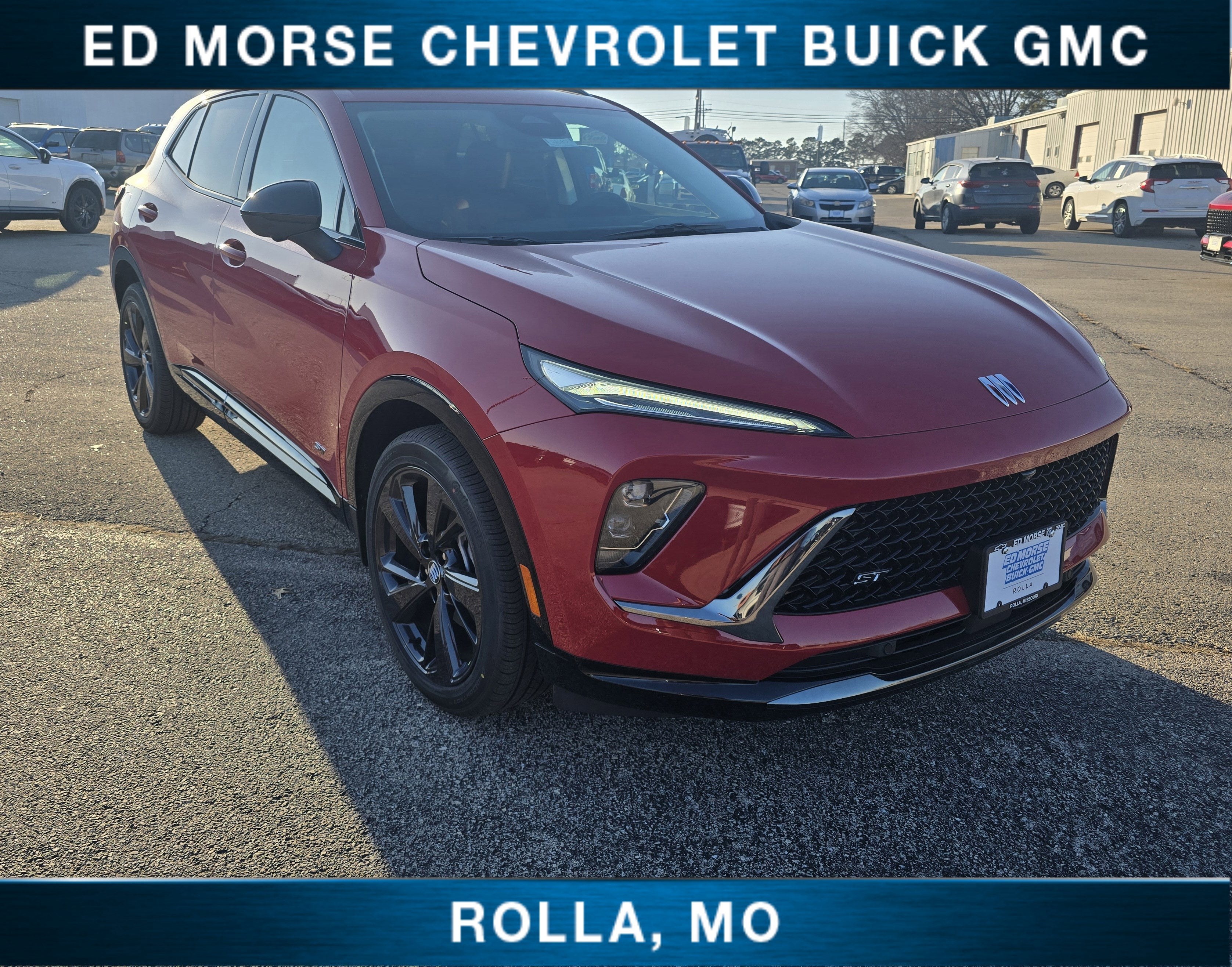 2026 Buick Envision Sport Touring in Brilliant Red — front three-quarter view