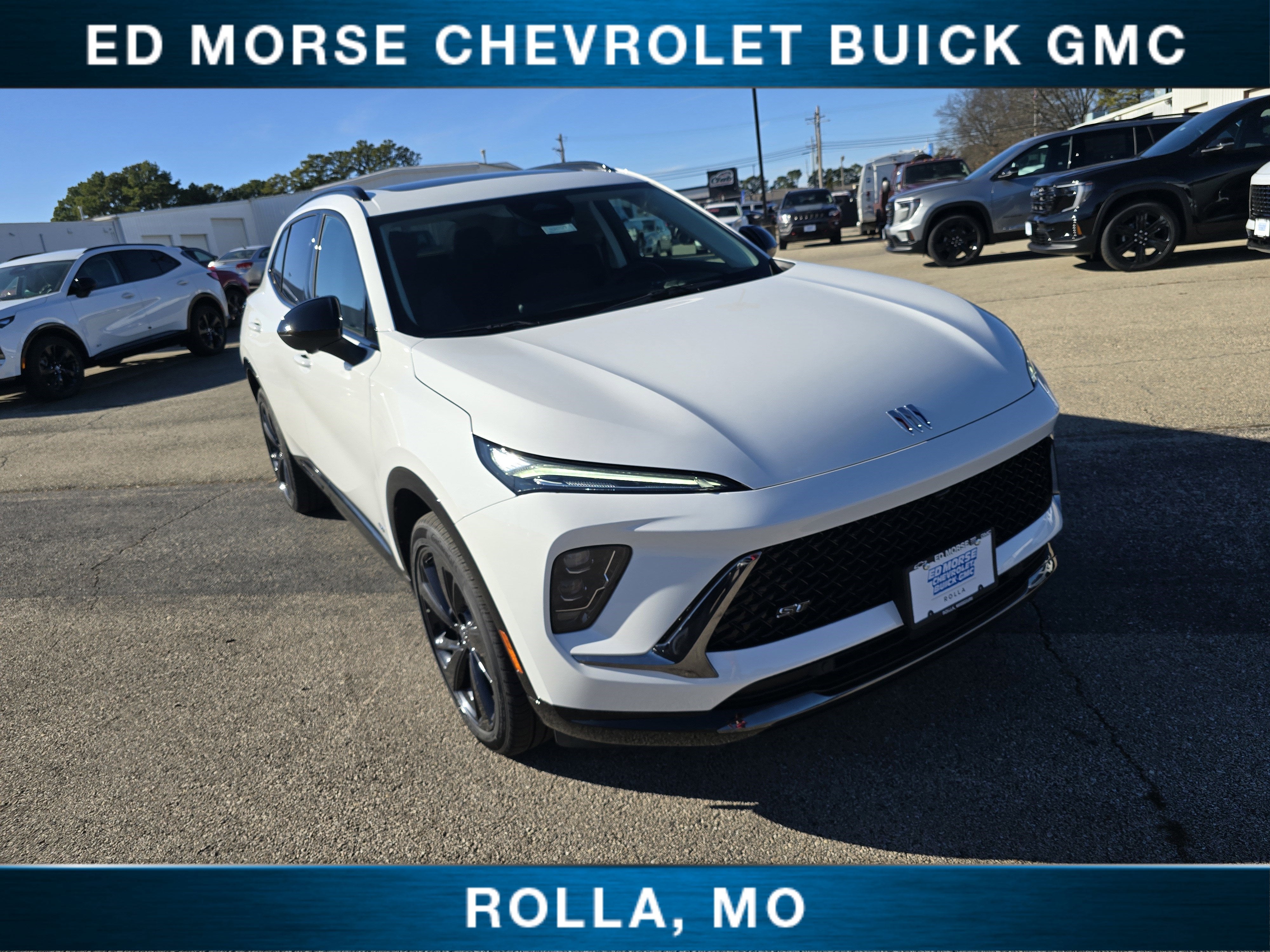2026 Buick Envision Sport Touring in Summit White — front three-quarter view